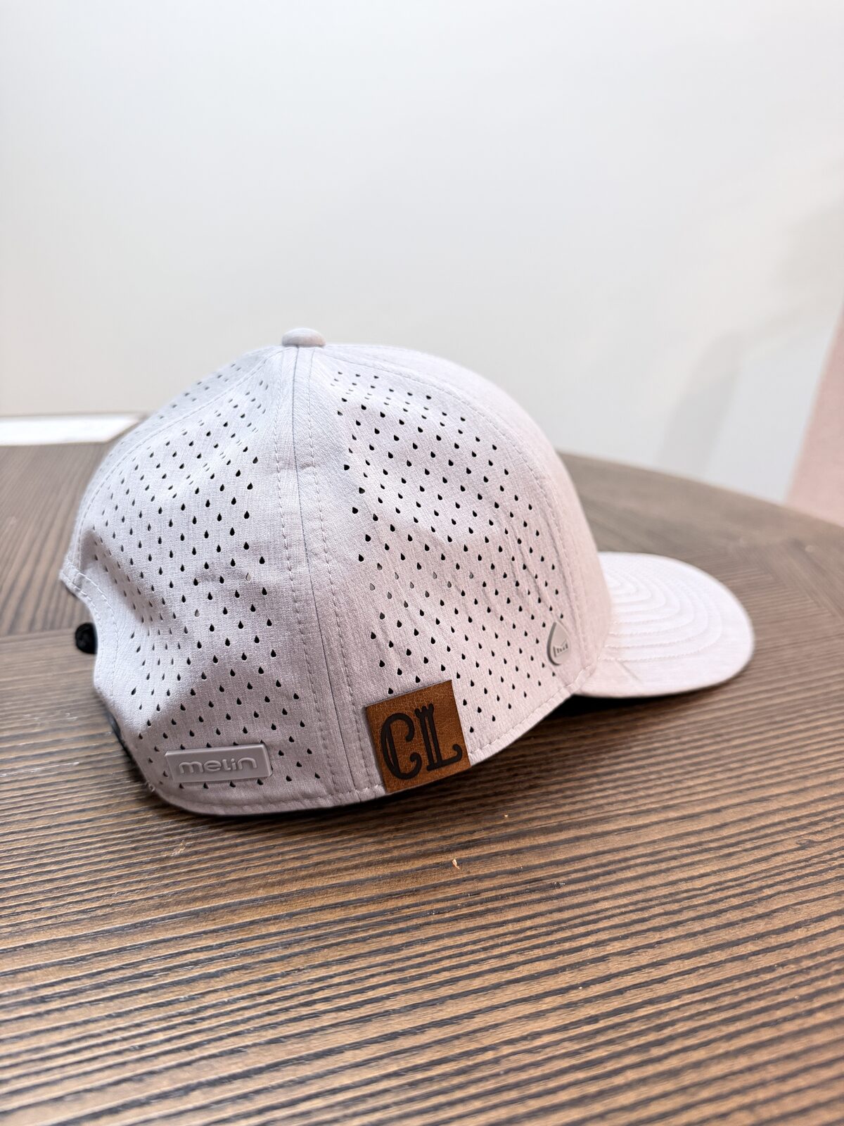 Custom leather patch cap finished at a wedding hat bar